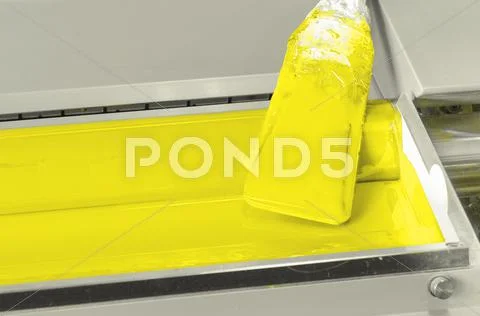 Yellow ink roller, printing press industrial machine, hand caution sign for a Stock Photos