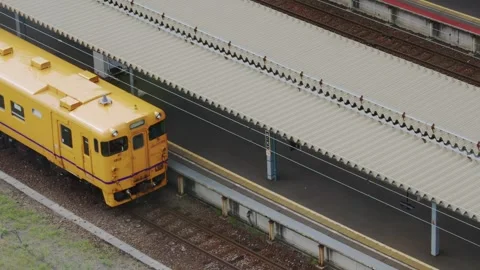 Yellow JR train parked at station platform, Hakodate, Japan, 2026.09.10. Stock Footage 345431592