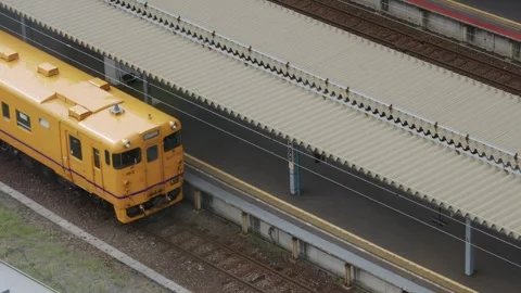 Yellow JR train parked at station platform, Hakodate, Japan, 2026.09.10. Stock Footage 345431778