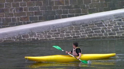 A yellow kayaker overtaking another one Stock Footage 66245083