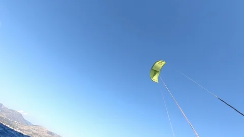 Yellow kite flying on sky background, extreme kite surfing in summer, amazing Video stock 126998758