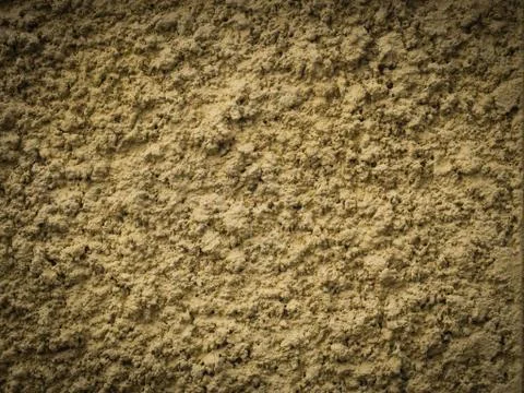 Yellow knobby cement wall for background Stock-Fotos