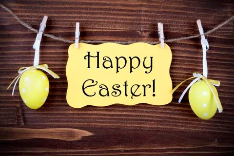 Yellow Label With Two Easter Eggs And Happy Easter Stock Photos