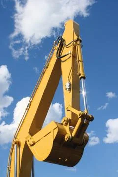 Yellow ladle of a dredge Stock Photos