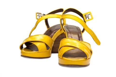 Yellow lady sandals Yellow lady sandals insulated on white background Copy... Stock Photos
