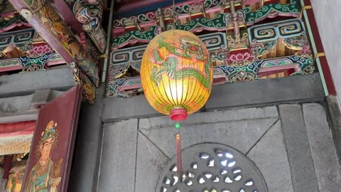 Yellow lantern blowing in the wind inside a Chinese temple Stock Footage 267562343