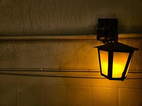 Yellow Lantern on Textured Wall Stock Photos