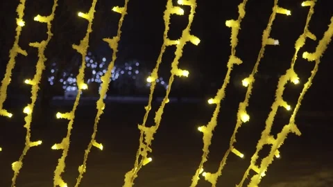 Yellow LED String Lights Close-Up with Bokeh at Night Stock Footage 327758423