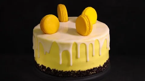 Yellow lemon cake on a stand on a dark background Stock Footage 95215989