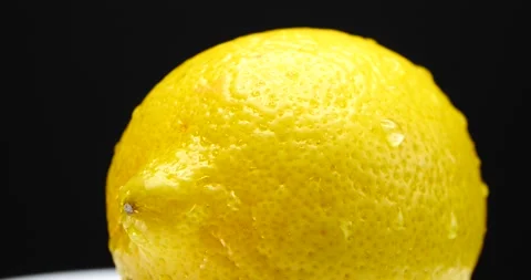 Yellow lemon close up rotating slow fresh fruit ready Stock Footage 205434624