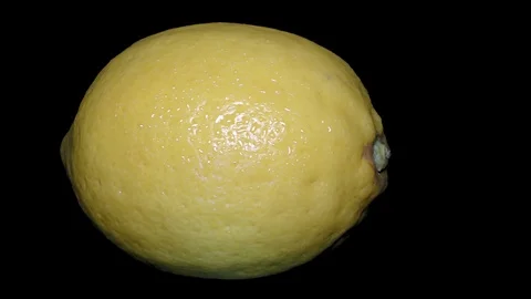 Yellow Lemon – Macro, Close up View on a Black Background Stock Footage 90220017