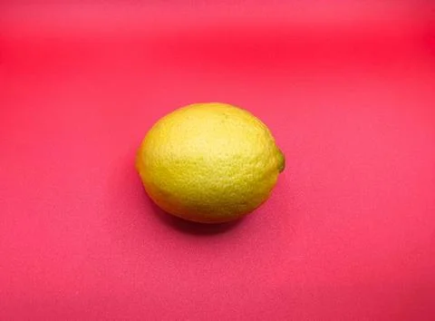 Yellow Lemon on Pink Background Stock Photos