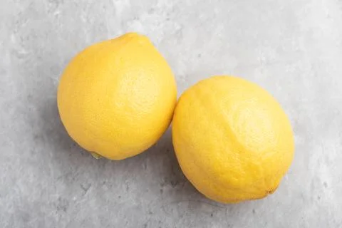 Yellow lemons on a gray background Foto stock