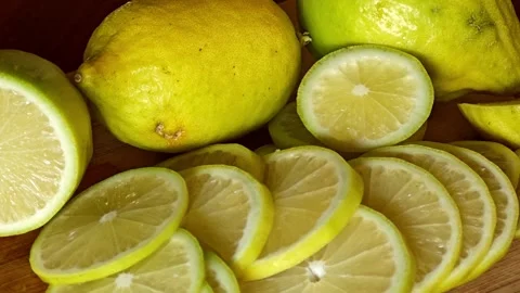 Yellow lemons sliced circle. Panning shot. Stock Footage 310035758