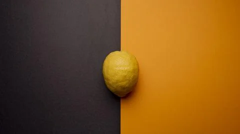 Yellow lemons on a two-tone background Stock Photos