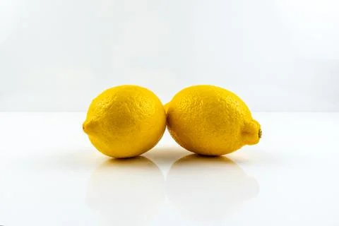 Yellow lemons on white background Stockfoto's