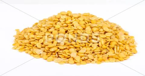 Yellow lentils isolated on white background.Macro shot Stock Photos