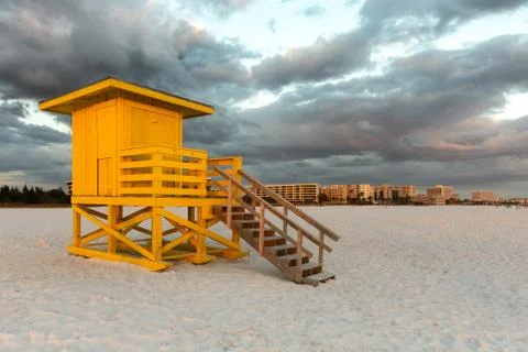 Yellow Lifeguard Tower Under Dramatic Sky Stock Photos