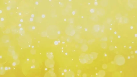 Yellow Light Bokeh Particles Background 4K Loop Bright golden bokeh lights float Video stock 310202248