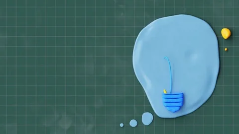 Yellow Light bulb made from plasticine on checkered blackboard. Video stock 261492777