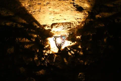 Yellow light effects in a cave below an historic castle Foto stock