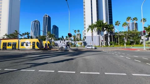 Yellow Light Rail Tram and City Traffic in Surfers Paradise Stock-Footage 341852916