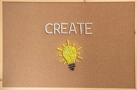 Yellow lightbulb with the word CREATE Stock Photos