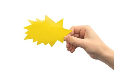 Yellow lightning or boom shape speech bubble in hand isolated on a white back Stock Photos