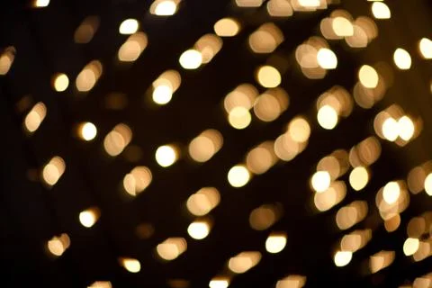 Yellow lights on dark background Stock Photos