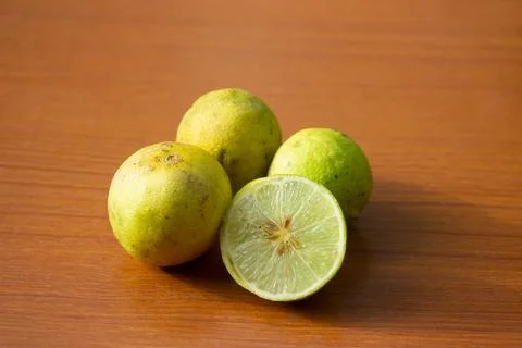 The yellow lime placed on the table is brown Stock Photos