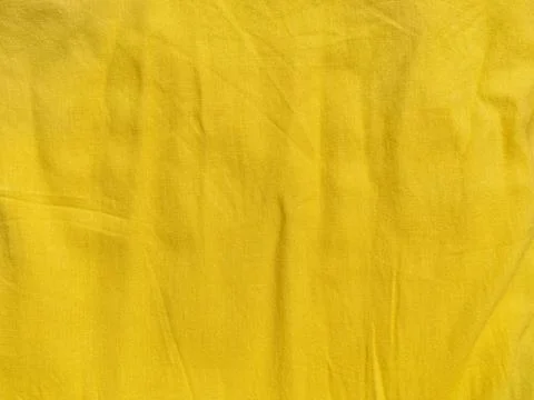 Yellow linen cloth texture pattern summer abstract design. Wavy natural texti Stock Photos