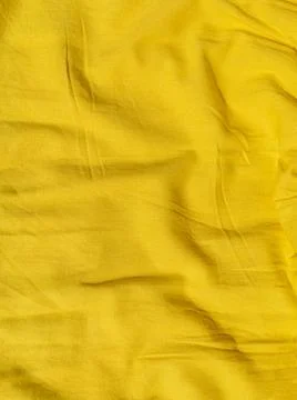 Yellow linen cloth texture pattern summer abstract design. Wavy natural texti Stock Photos