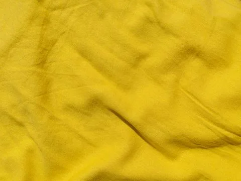 Yellow linen cloth texture pattern summer abstract design. Wavy natural texti Stock Photos