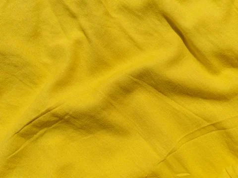 Yellow linen cloth texture pattern summer abstract design. Wavy natural texti Stock Photos