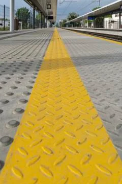 Yellow lines at the train station Stock Photos