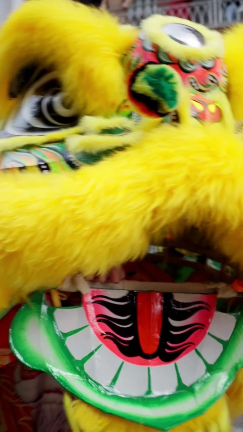 Yellow lion dancing among de crowd of people Stock Footage 288075187
