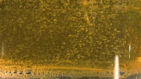 Yellow liquid with air bubbles Video stock 97846150