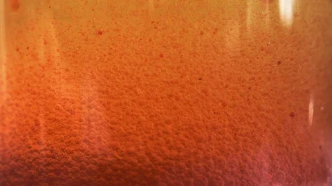Yellow liquid with air bubbles Stock Footage 97848265