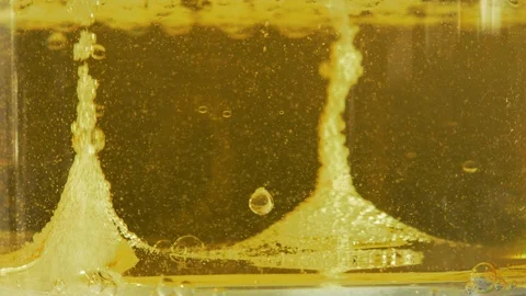 Yellow liquid with air bubbles Stock Footage 97892495