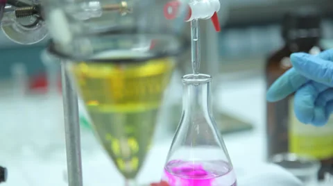 Yellow liquid in beaker in research lab Stock Footage 36267852