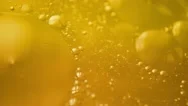 Yellow Liquid With Bubbles Stock Footage