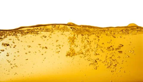 Yellow liquid with bubbles Stock Photos