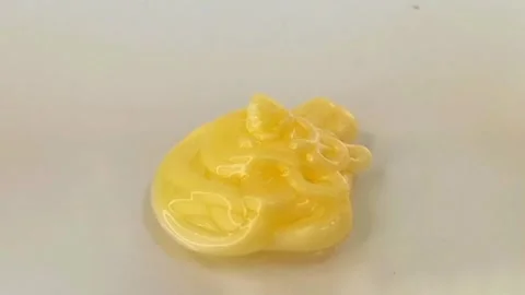 Yellow liquid creamy texture face wash, shampoo, cleanser, cosmetic or skincare Stock Footage 297657124