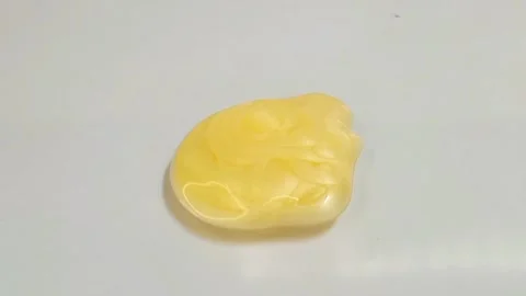 Yellow liquid creamy texture face wash, shampoo, cleanser, cosmetic or skincare Stock Footage 297657175