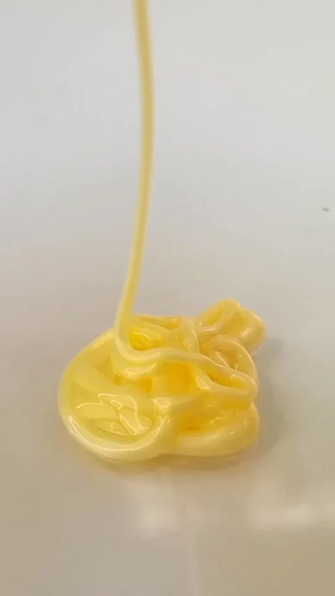 Yellow liquid creamy texture face wash, shampoo, cleanser, cosmetic or skincare Stock Footage 297657176