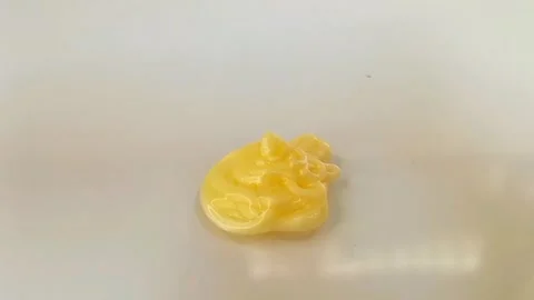 Yellow liquid creamy texture face wash, shampoo, cleanser, cosmetic or skincare Stock Footage 297657181