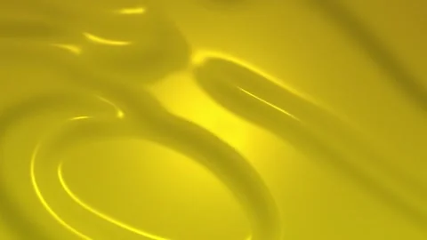 Yellow liquid with smooth wave patterns. 스톡 동영상 333520444