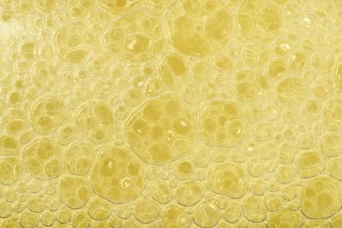 Yellow Liquid Soap Bubbles Texture Background Stock Photos