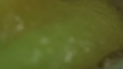 Yellow Liquid Spilling onto Sand MAC Stock Footage 74752329