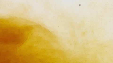 Yellow liquid in water on a white background. Stock Footage 236822659